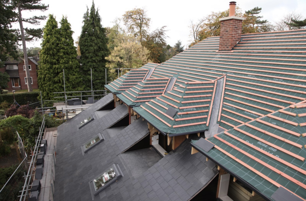 A new slate roof with clay-tiled dormers and Velux roof lights, finished by Carter Roofing