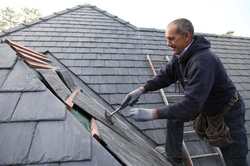 Mick working on a slate roof